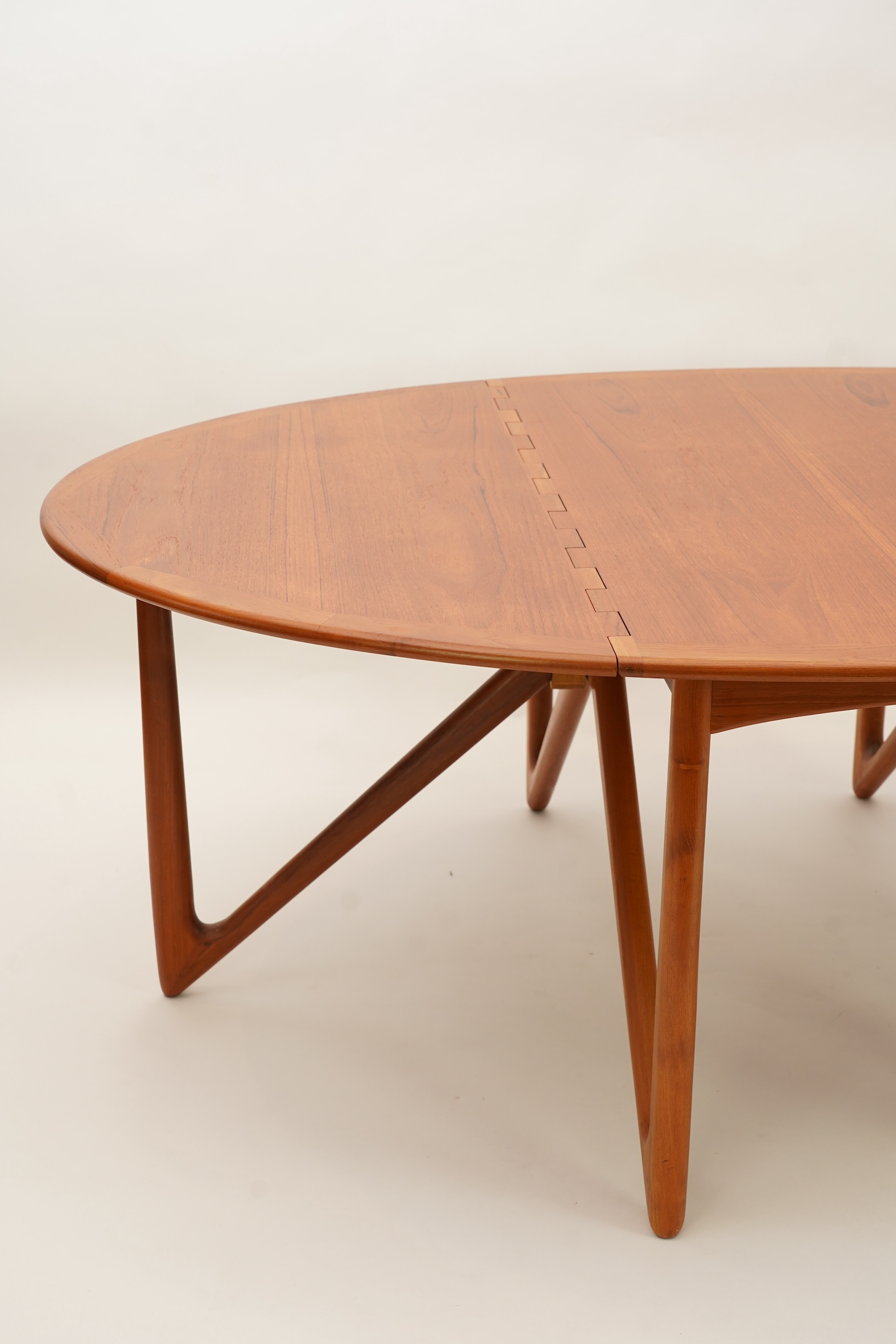 Niels Koefoed (Danish, b. 1929) for Koefoeds Møbelfabrik: A teak 'Oval Klap' dining table